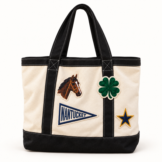 Natural and black canvas tote with Nantucket pennant, horse, clover and star patches, a wedding welcome bag