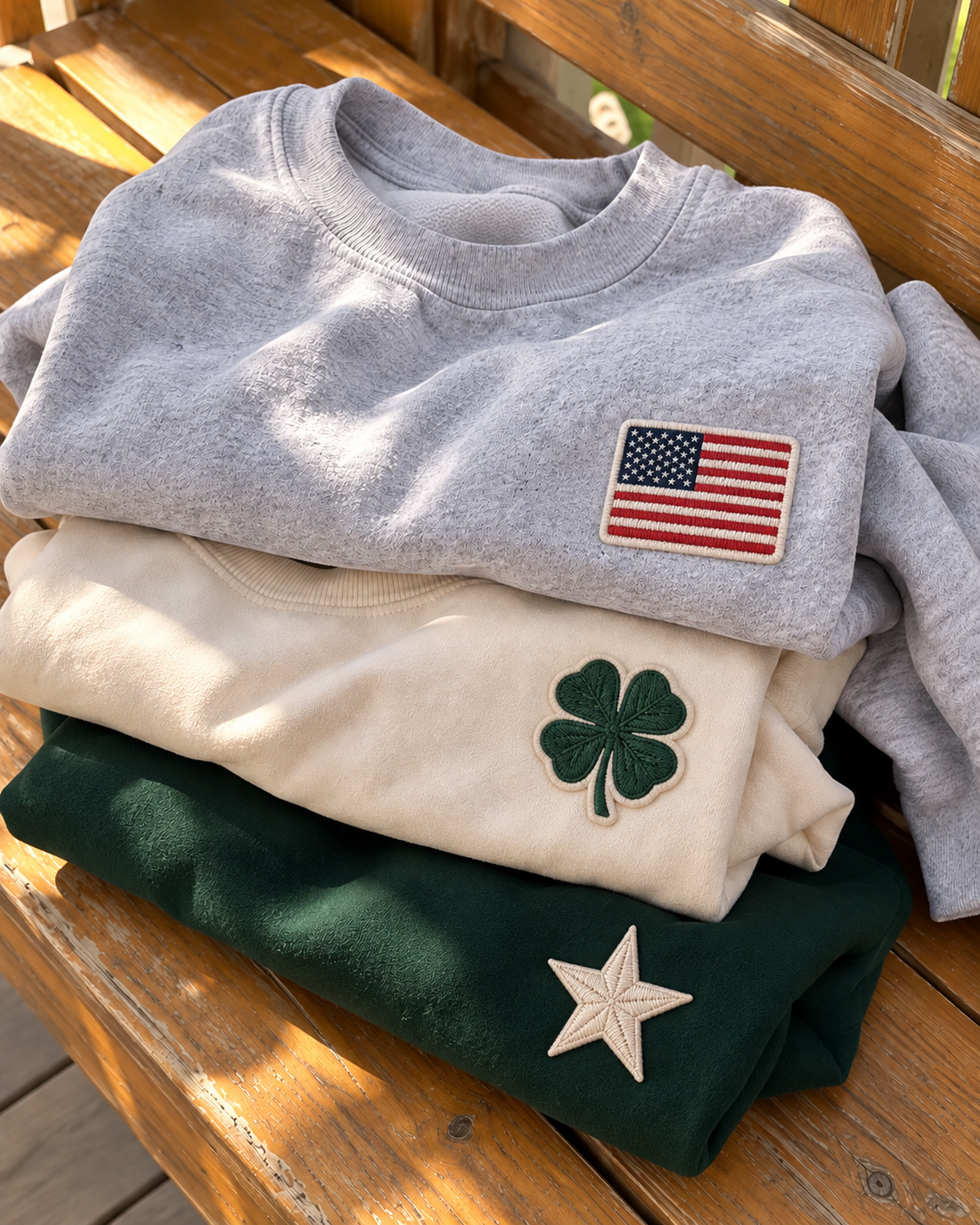 Stack of custom patch crewneck sweatshirts in grey, cream and green, personalized gifts under $75